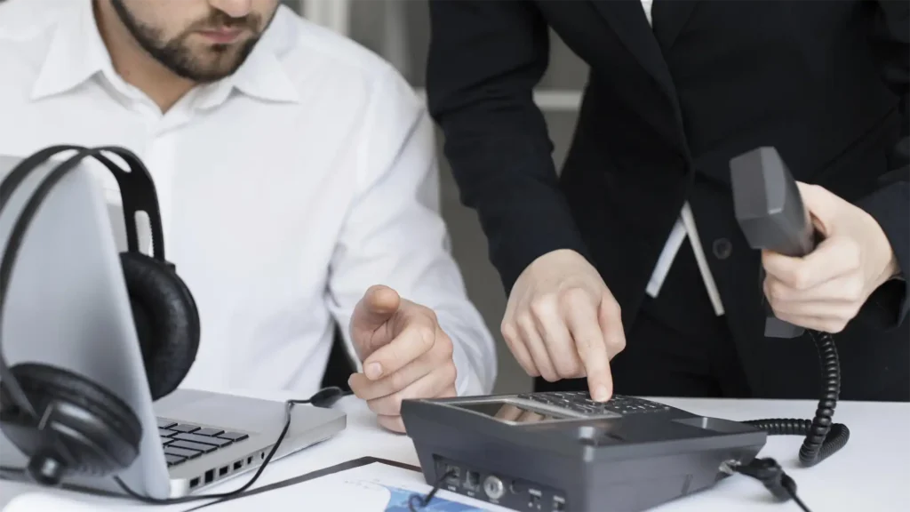 image showing tow business professional's dialing into a globalmeet operator assisted conferencing call