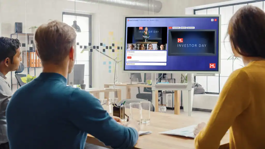 a group of investor relations professionals watching an online investor conference presentation