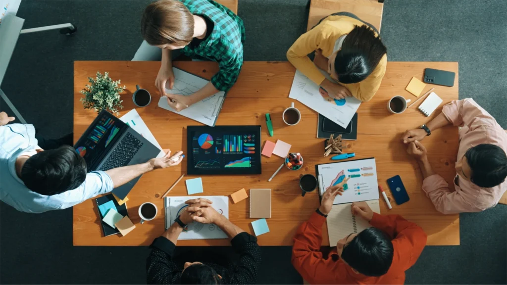 A top down view of a marketing team planning an event